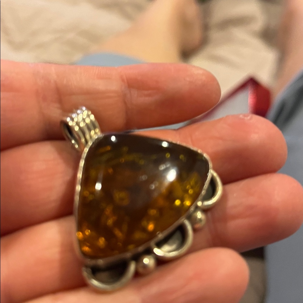Triangular Amber Pendant With Silver Detailing - image 2